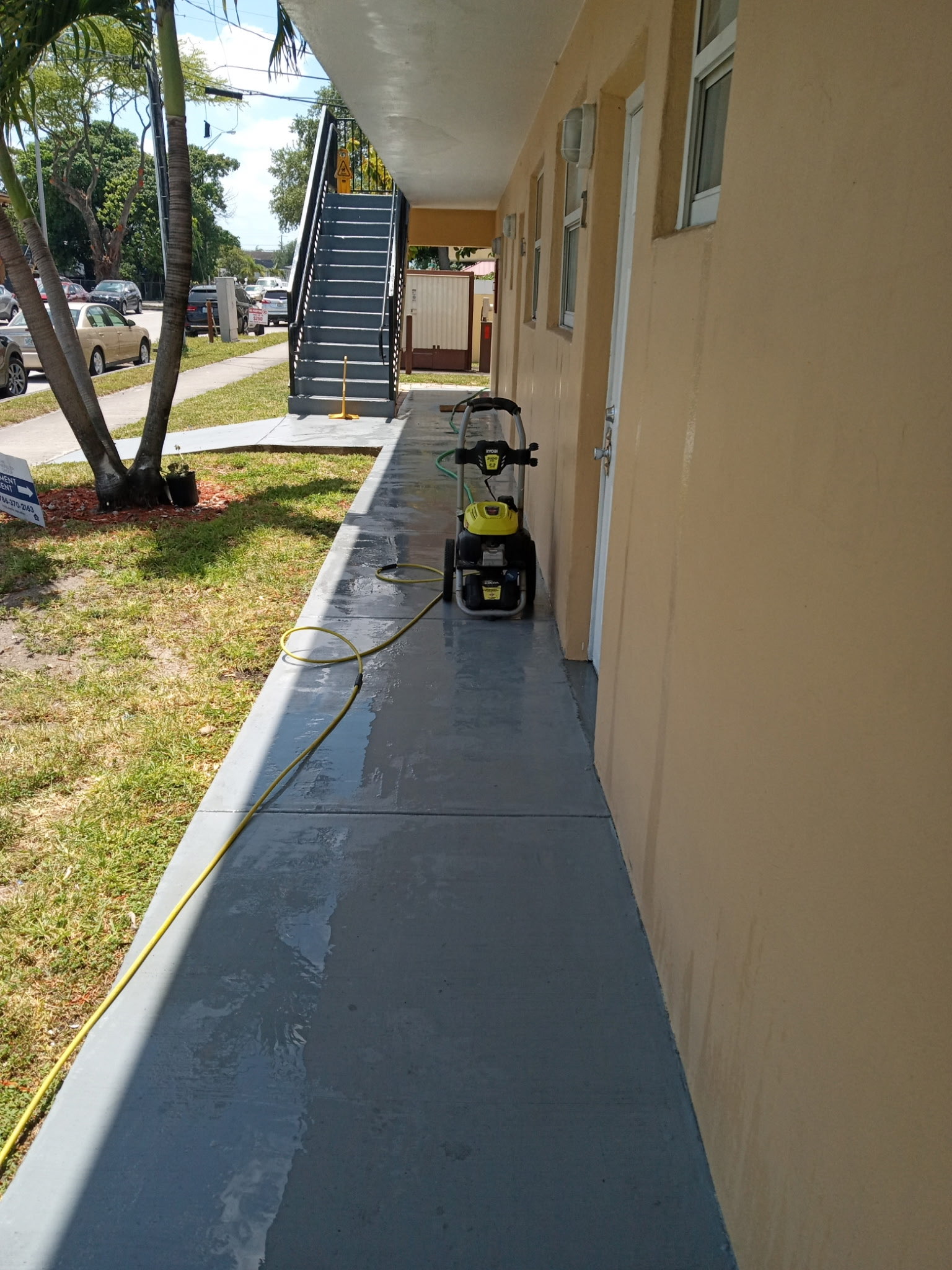 Freshly pressure-washed apartment walkway